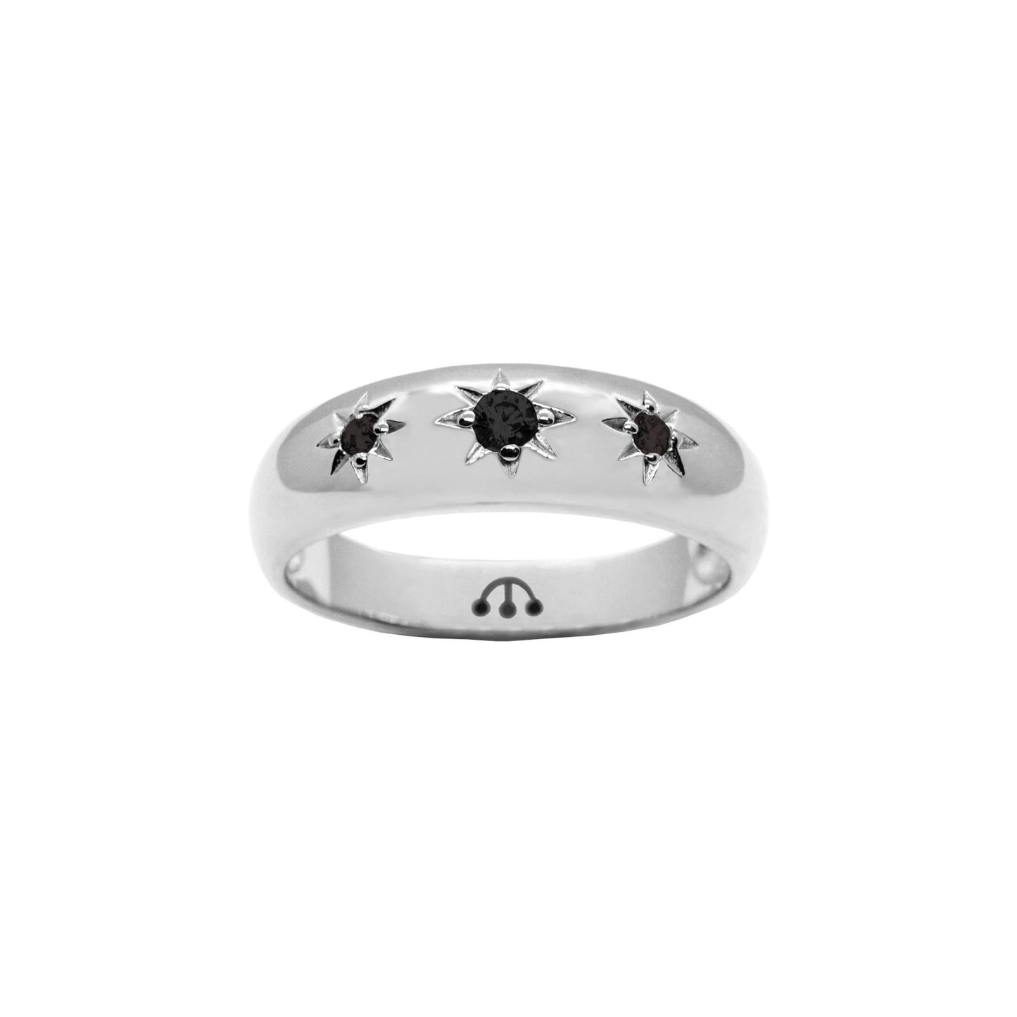 three natural jet stones set in starburst setting on silver rhodium band.
