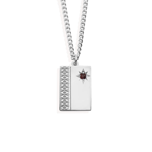 sterling silver ingot wit diamond engraving and garnet set starburst on sterling silver curb chain.