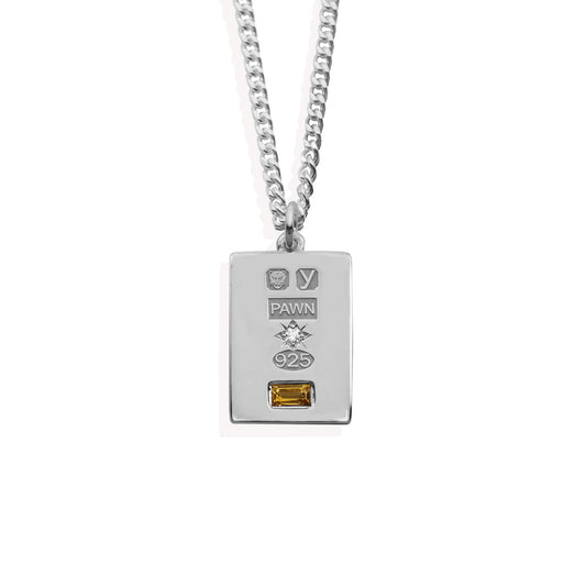 sterling silver ingot with pawnshop hallmarks and cz set stone burst and citrine rectangle.