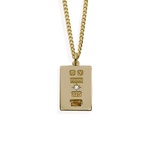 9k gold ingot with pawnshop hallmarks cz set stoneburt, and citrine set stone on 9k gold curb chain.