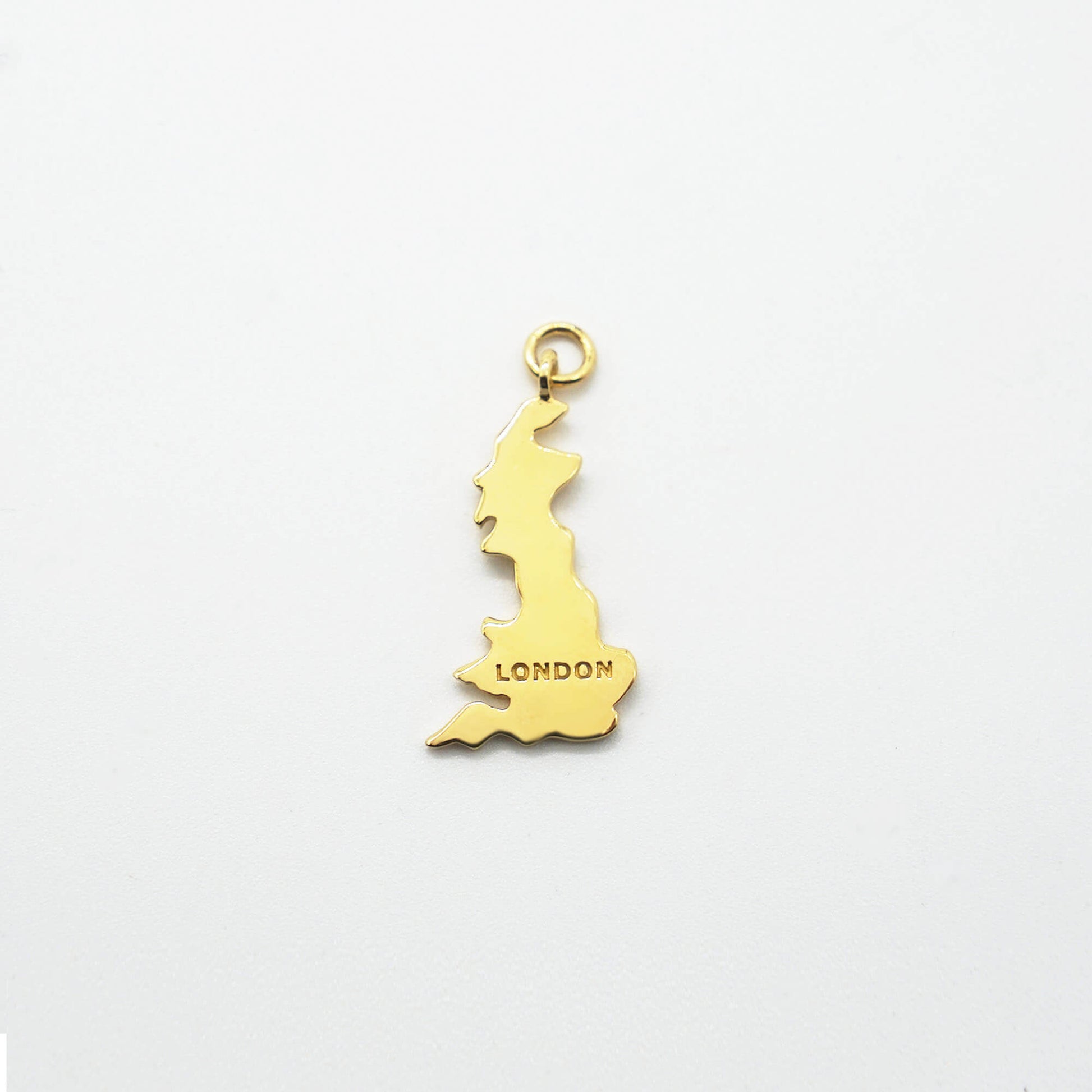 GB SHAPED MAP CHARM PENDANT IN REAL GOLD PLATE OVER STERLING SILVER WITH LONDON MARK.