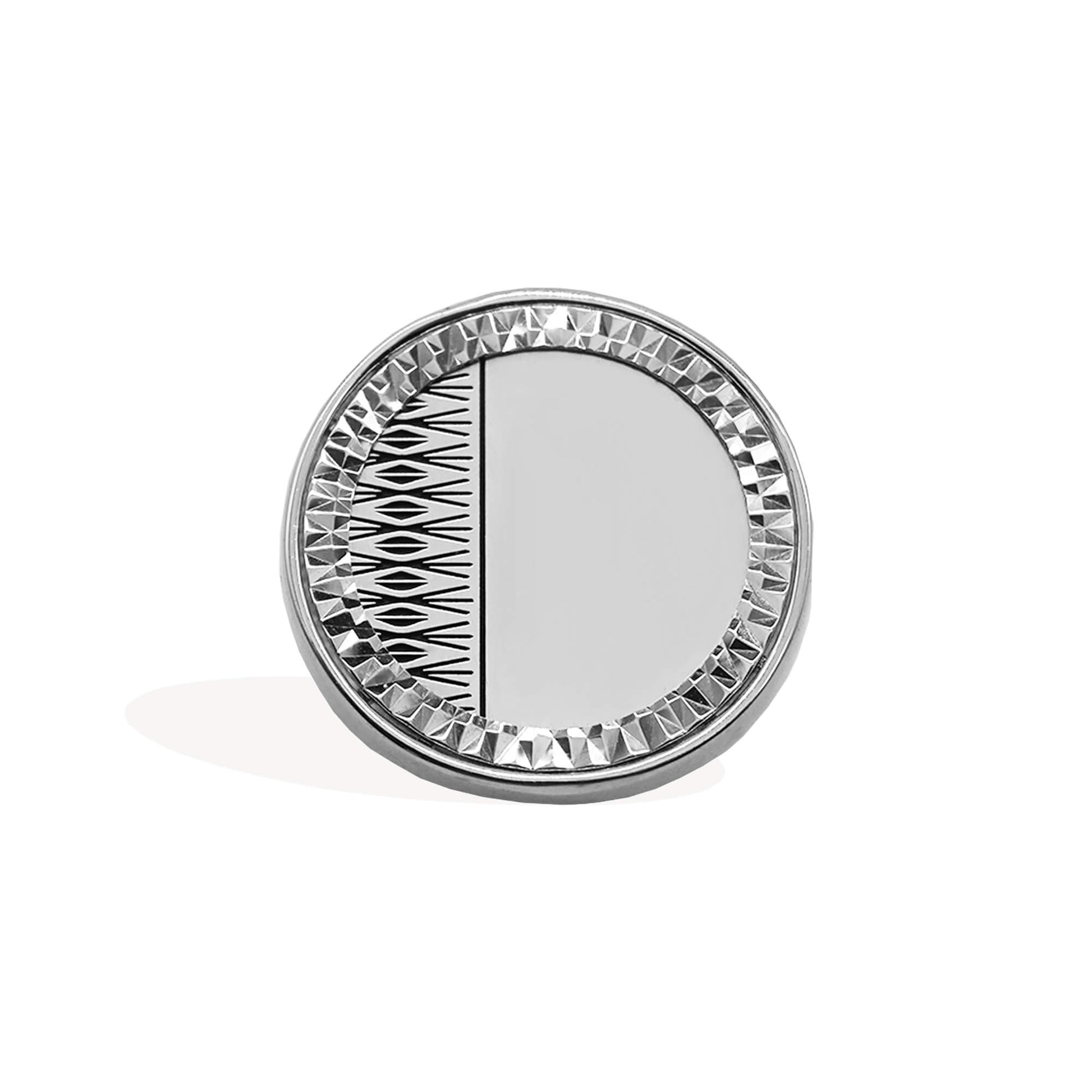 silver half sovereign ring with bezel surround and diamond pattern engraving.