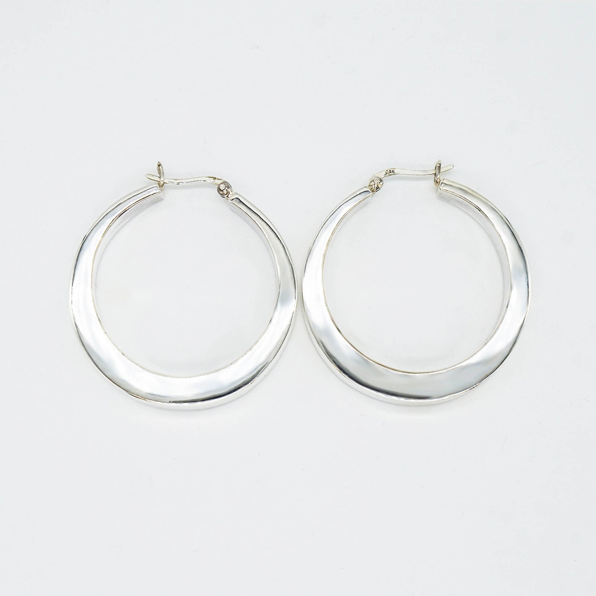 PAIR SILVER HOLLOW SQUARED OFF HOOPS.