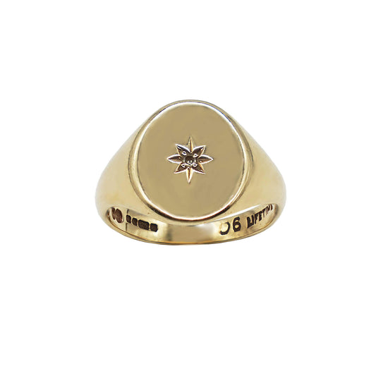 Close up Vintage Oval face 9K gold solid signet ring- with diamond starburst centre- hallmarks can be seen on inner band.