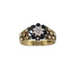 vintage 9k gold wide band ring with textured diamond shape detail on band and a centre flower of sapphire and diamond. Hallmarks visible on inner band.