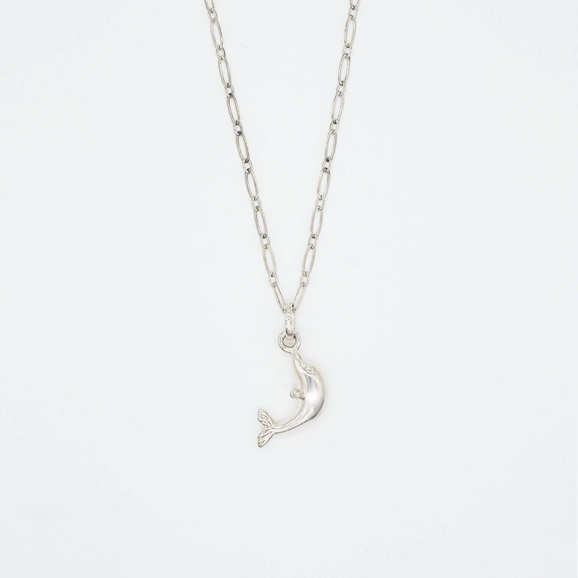Vintage sterling silver dolphin on an open link chain necklace.